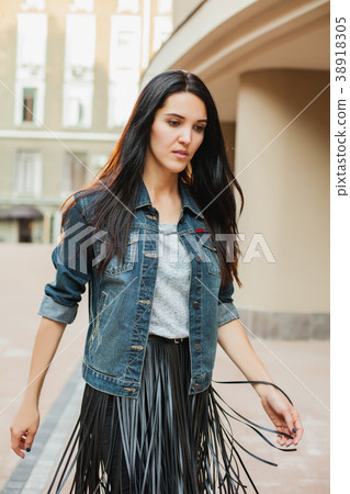 young female walking around city young female walking around city 38918305