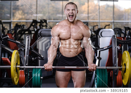 Brutal strong bodybuilder athletic men pumping up muscles with d Brutal strong bodybuilder athletic men pumping up muscles with d 38919185