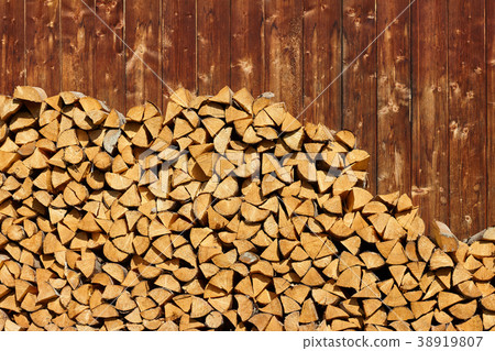 Pile of wood logs background 38919807