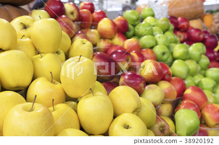 juicy apple background of yellow, red, green fruit 38920192