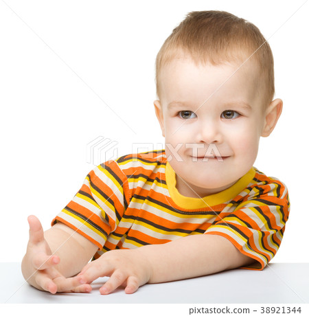 Portrait of a cute little boy looking at something 38921344