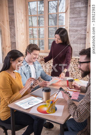 Joyful nice people sitting together Joyful nice people sitting together 38922983