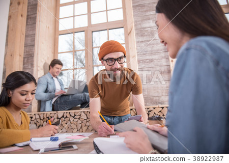 Smart young man taking notes 38922987