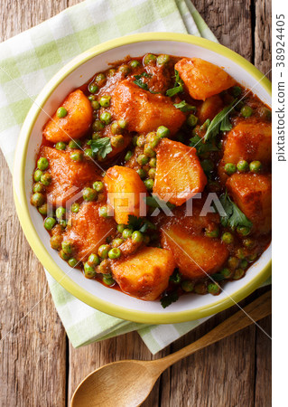 Vegetarian Indian Aloo Matar made from potatoes 38924405
