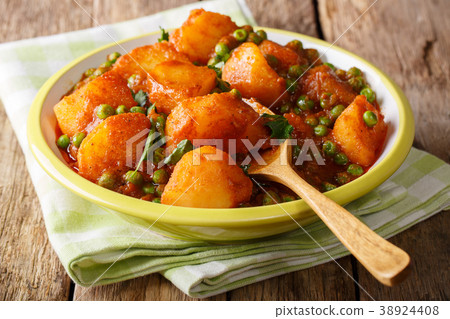 Vegetarian Indian Aloo Matar made from potatoes Vegetarian Indian Aloo Matar made from potatoes 38924408