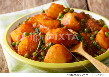 Indian hot Aloo Matar - potatoes, green peas Indian hot Aloo Matar - potatoes, green peas 38924409