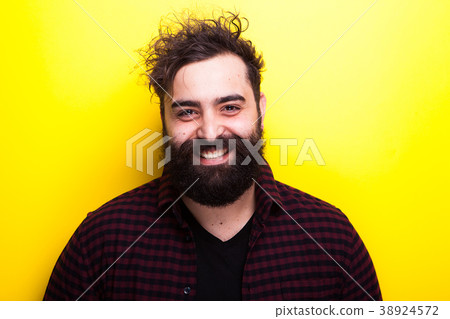 Portrait of smiling bearded man looking at the 38924572
