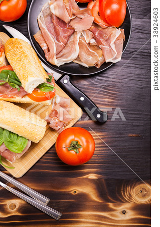 Homemade sandwiches on a wooden board Homemade sandwiches on a wooden board 38924603