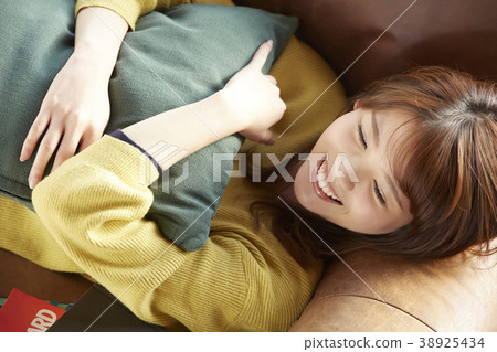 A woman relaxing in the room 38925434