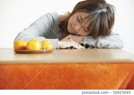 A woman relaxing with kotatsu 38925695