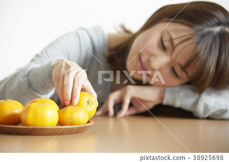 A woman relaxing with kotatsu A woman relaxing with kotatsu 38925698
