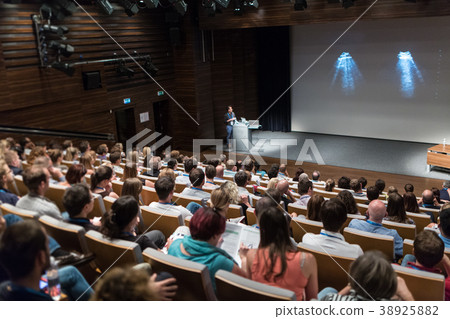 Business speaker giving a talk in conference hall. Business speaker giving a talk in conference hall. 38925882