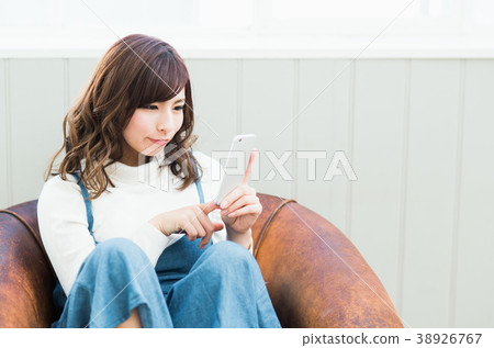 A young lady (a smartphone) A young lady (a smartphone) 38926767