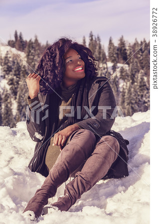 Happy African woman in winter 38926772