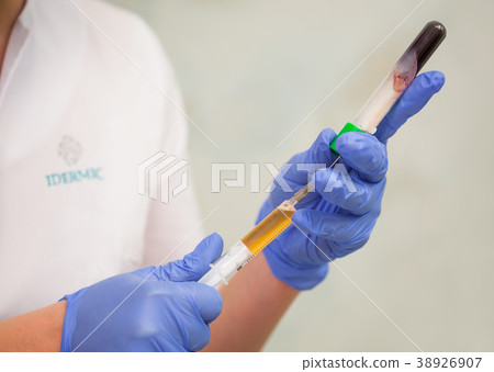 Close-up view of beautician hands gaining the 38926907