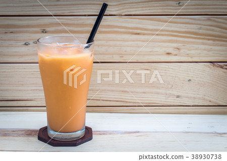 Milk ice tea on wooden background 38930738