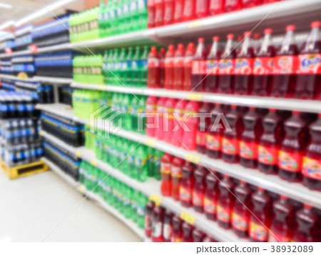 Drink bottles on shelves in a supermarket blur Drink bottles on shelves in a supermarket blur 38932089