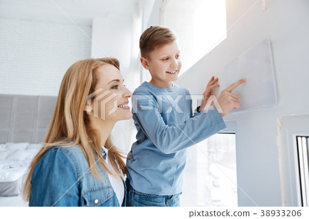 Joyful happy boy living in the smart house Joyful happy boy living in the smart house 38933206