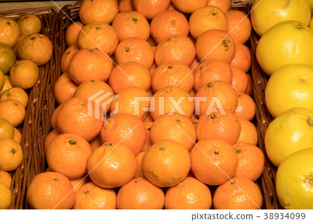 Bunch of fresh mandarin oranges on market. Bunch of fresh mandarin oranges on market. 38934099
