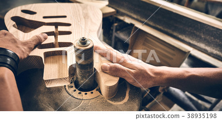 Manufacture of guitars. 38935198