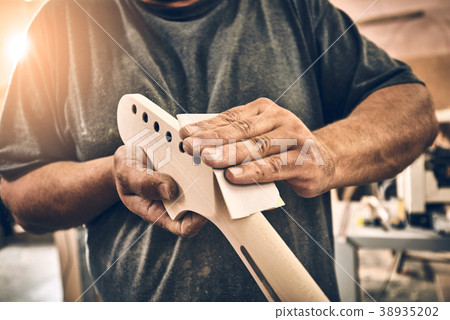 Manufacture of guitars. 38935202