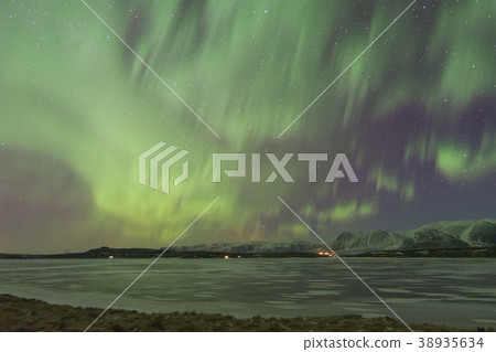 Northern lights above a countryside in Iceland Northern lights above a countryside in Iceland 38935634