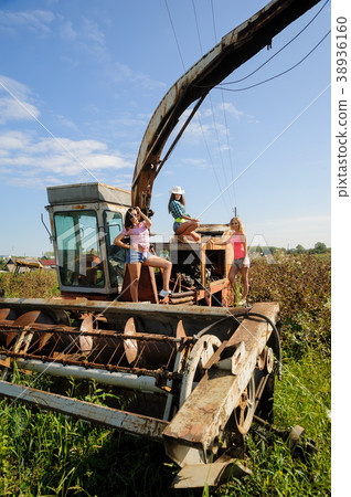 Beautiful women on old harvester Beautiful women on old harvester 38936160