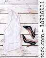 Women classic waistcoat and black stilettos. 38936931