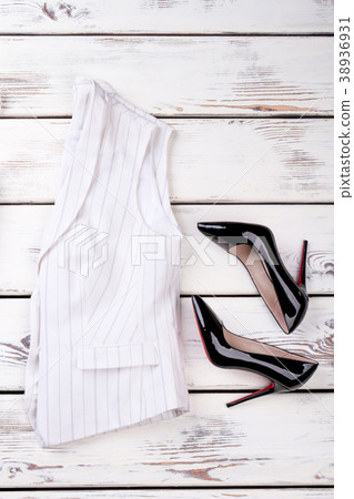 Women classic waistcoat and black stilettos. Women classic waistcoat and black stilettos. 38936931