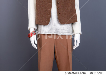 Combination of white and brown female apparel. Combination of white and brown female apparel. 38937203