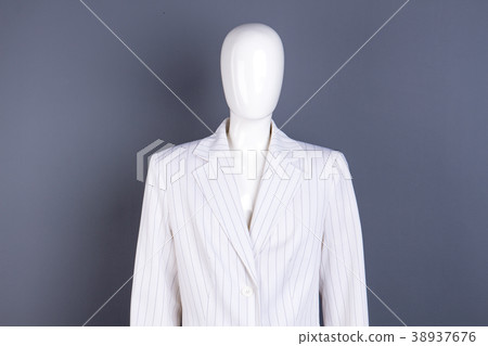 Female mannequin in white striped blazer. Female mannequin in white striped blazer. 38937676