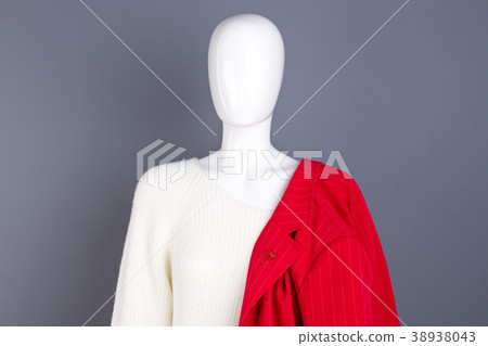 Female mannequin with clothes, grey background. Female mannequin with clothes, grey background. 38938043