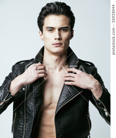 young handsome man, leather jacked on naked torso 38938044