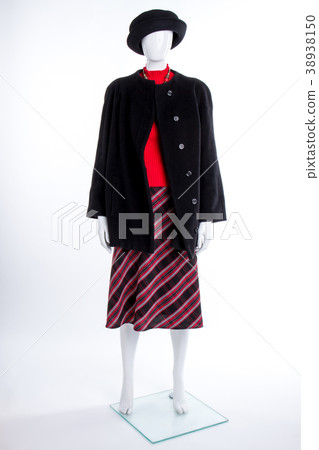 Black hat, coat and striped skirt. 38938150