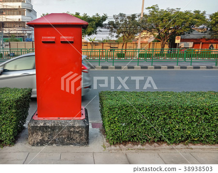 Red postbox on footpath in Thailand 38938503