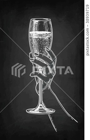 Hand holding a glass of champagne. Hand holding a glass of champagne. 38939719