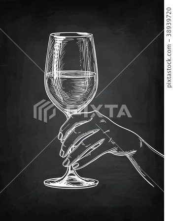 Hand holding a glass of wine. Hand holding a glass of wine. 38939720