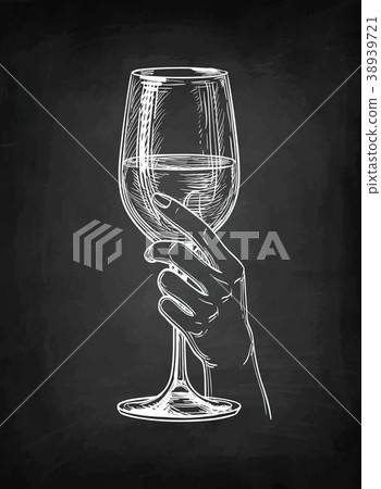 Hand holding a glass of wine. Hand holding a glass of wine. 38939721