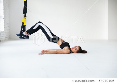 Fit pretty young woman doing stretching. 38940506