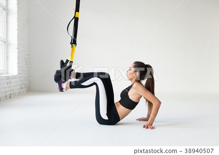 Fit pretty young woman doing stretching. 38940507