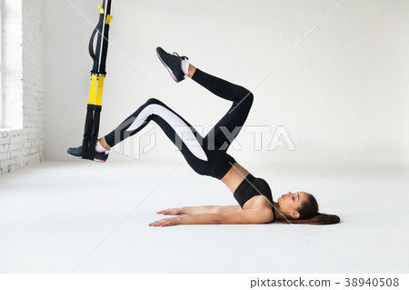 Fit pretty young woman doing stretching. Fit pretty young woman doing stretching. 38940508
