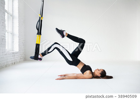 Fit pretty young woman doing stretching. Fit pretty young woman doing stretching. 38940509