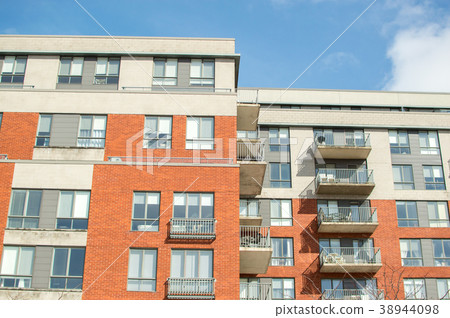Modern condo buildings with huge windows and balco 38944098