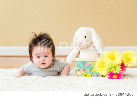 Baby boy with a rabbit celebrating Easter Baby boy with a rabbit celebrating Easter 38944265