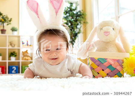 Baby boy with a rabbit celebrating Easter Baby boy with a rabbit celebrating Easter 38944267