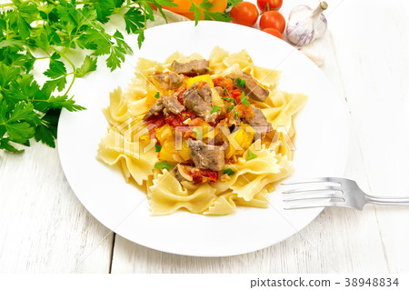 Farfalle with turkey and vegetables in plate 38948834