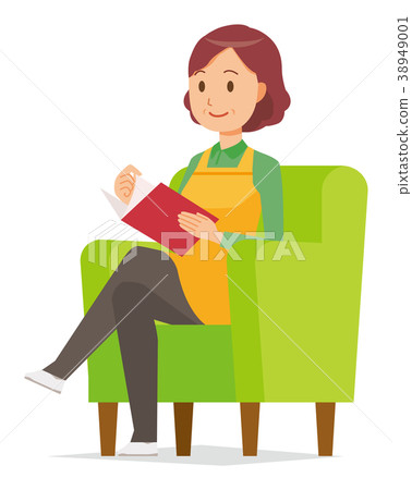 Middle-aged housewife with apron sitting on the sofa and reading 38949001