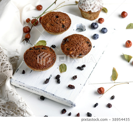 baked cupcakes with dried fruits baked cupcakes with dried fruits 38954435