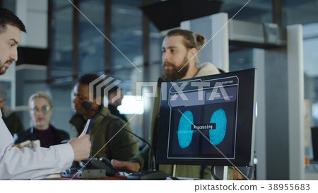Man passing biometric control at counter 38955683