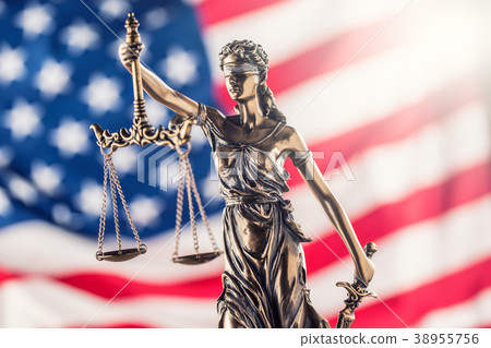 Lady Justice and American flag. 38955756